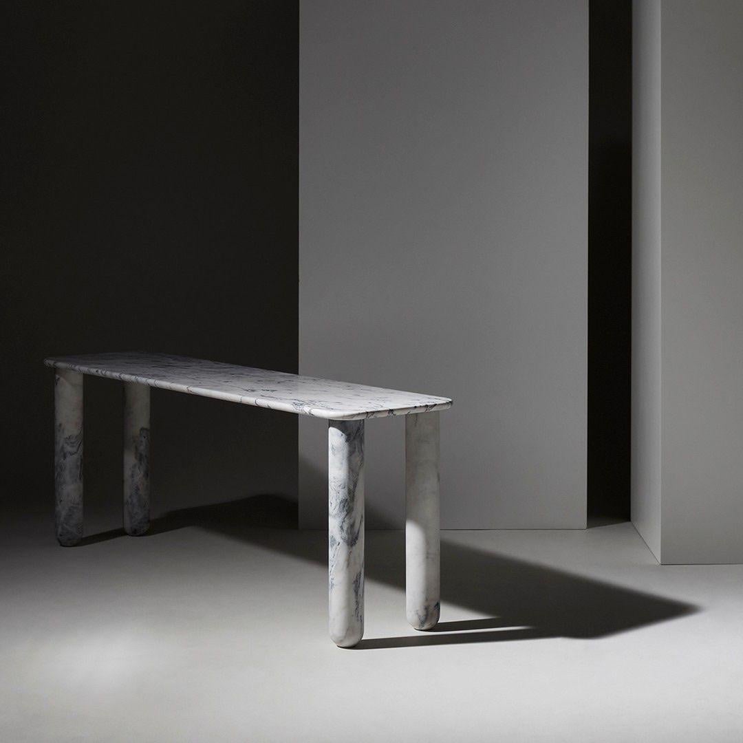 Sunday is a family of tables, consoles and desks with a simple and clean design vocabulary. The combination of heavy marble legs with the thin solid wood or marble top creates an interesting contrast while the rounded edges and generous proportions