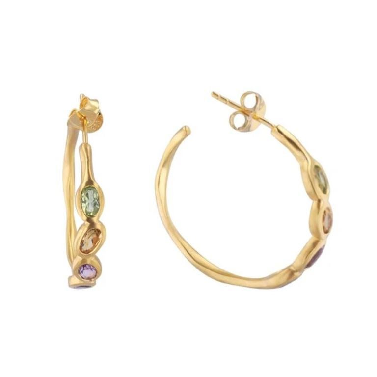 Keep your faith in hoops. All colors, all sizes, they all need love. It's the blessing to elevate your everyday look. 


Materials:

Metal: 18K Brushed Gold

Gemstones: .20 Carat Oval Citrine, Oval Amethyst, Oval Peridot, Oval Mystic Blue