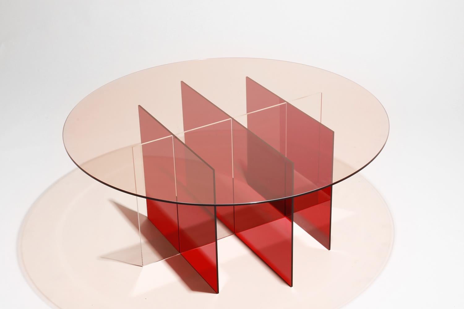 Made to order. Please allow 6 weeks for production.

The Sundial coffee table is an experiential furniture piece, with distinct profiles and playful interaction with light and shadow. The table appears paper thin from one angle and then the full
