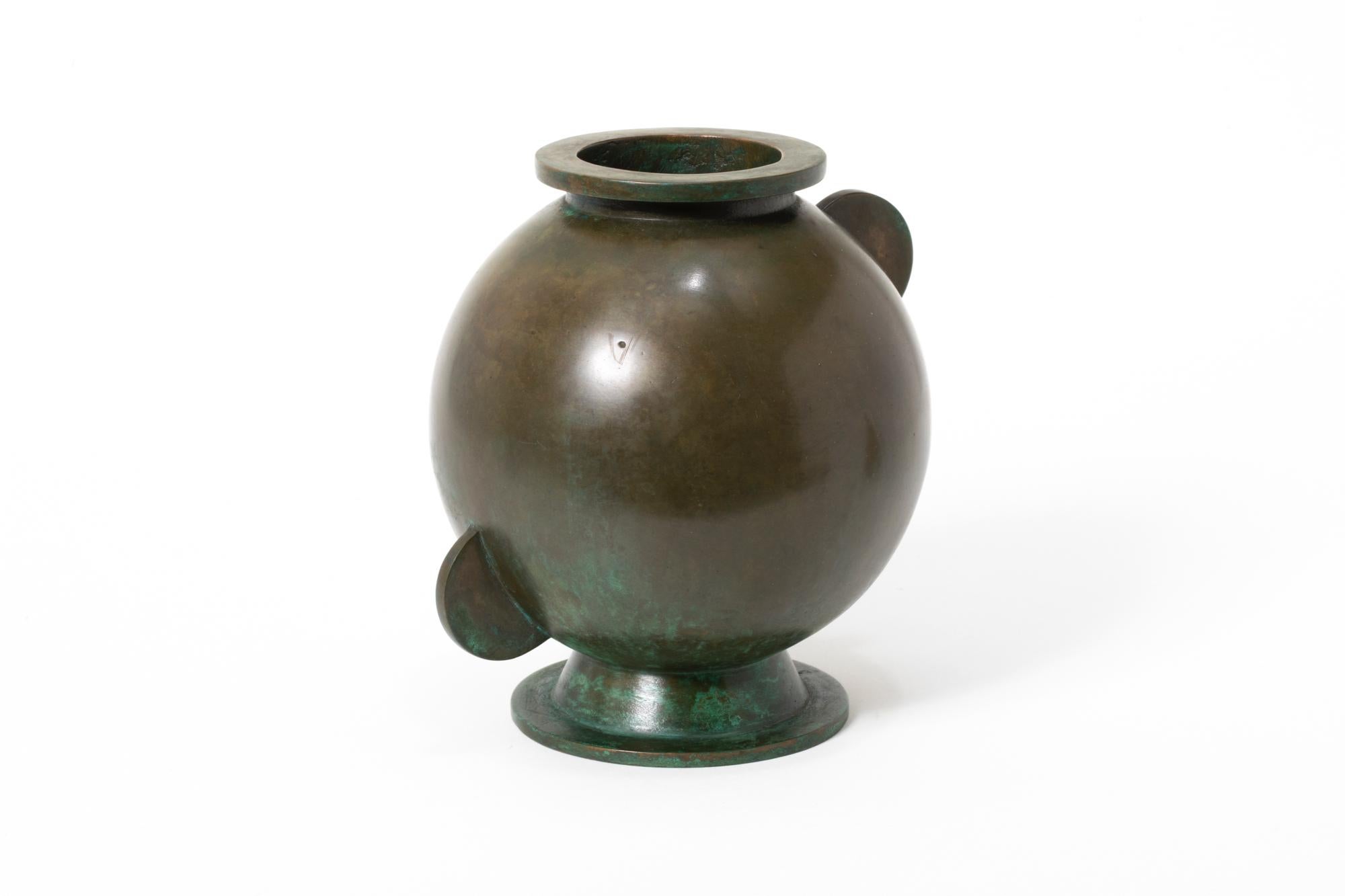 An asymmetrical modernist bronze vase created by the Swedish designer Sune Bäckström in the 1930s. Stamped with a makers mark, this Art Deco piece is representative of Bäckström's fine metalwork that he distributed out of Malmö, Sweden throughout