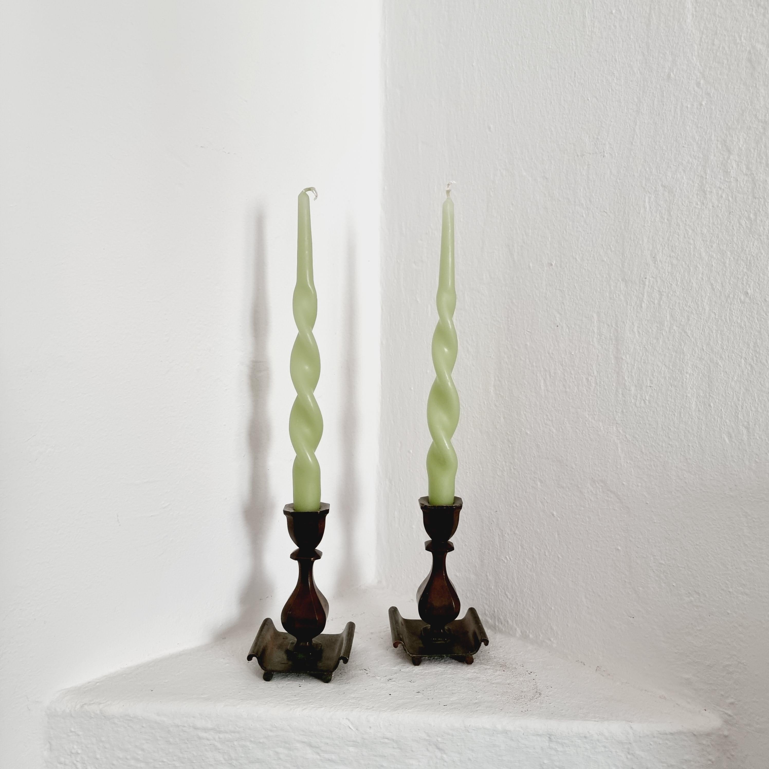 A pair of solid bronze candlesticks, by Sune Backström, Sweden. Swedish Modern / Art Deco. 

Signed: Sune Backström, Brons. 

Guldsmedsaktiebolaget / GAB, is a Swedish manufacturer of cutlery in Eskilstuna. The company was founded in Stockholm
