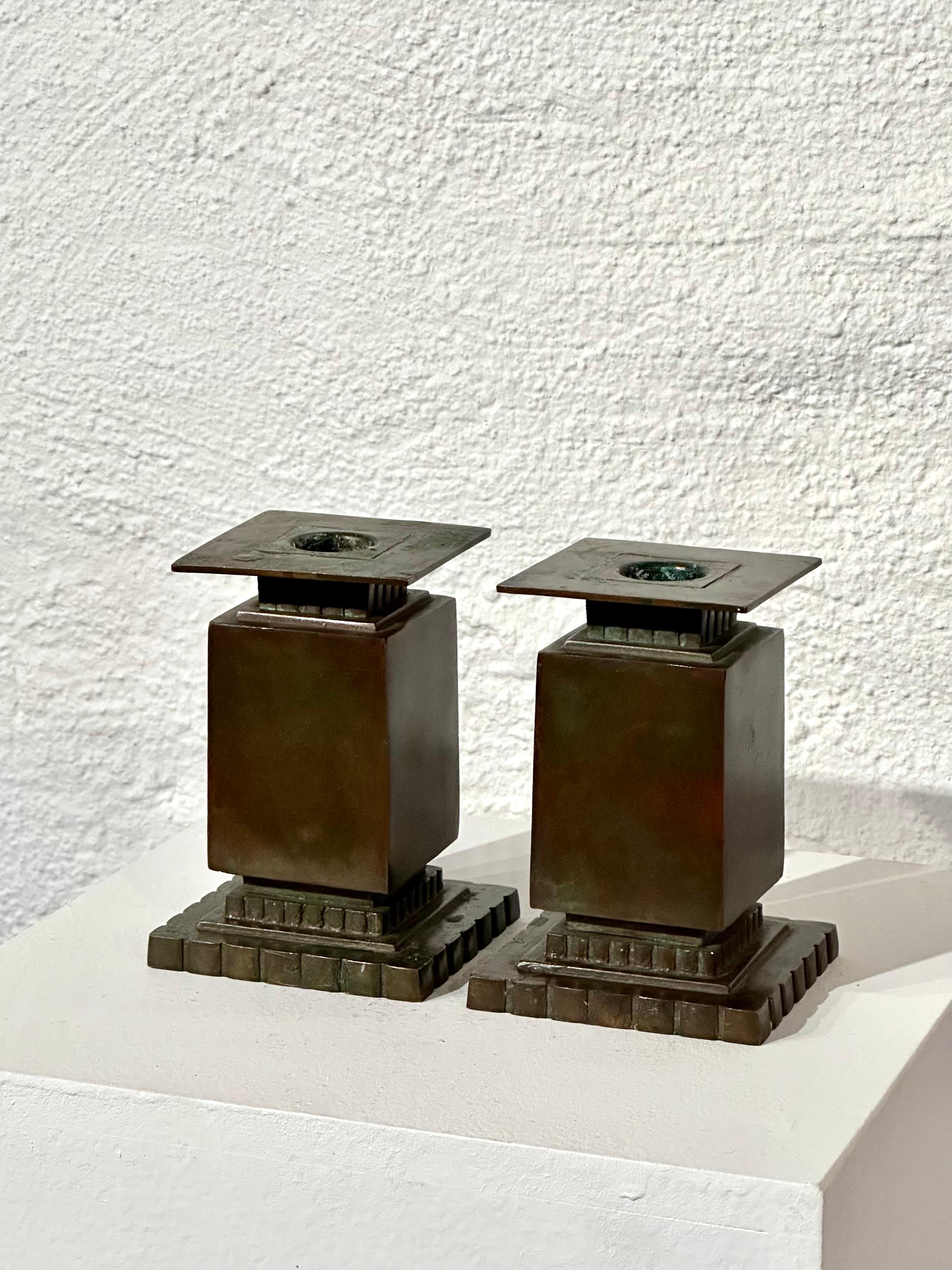 Pair of green patinated bronze candlesticks by Sune Bäckström. Produced in Sweden in the 1930s.