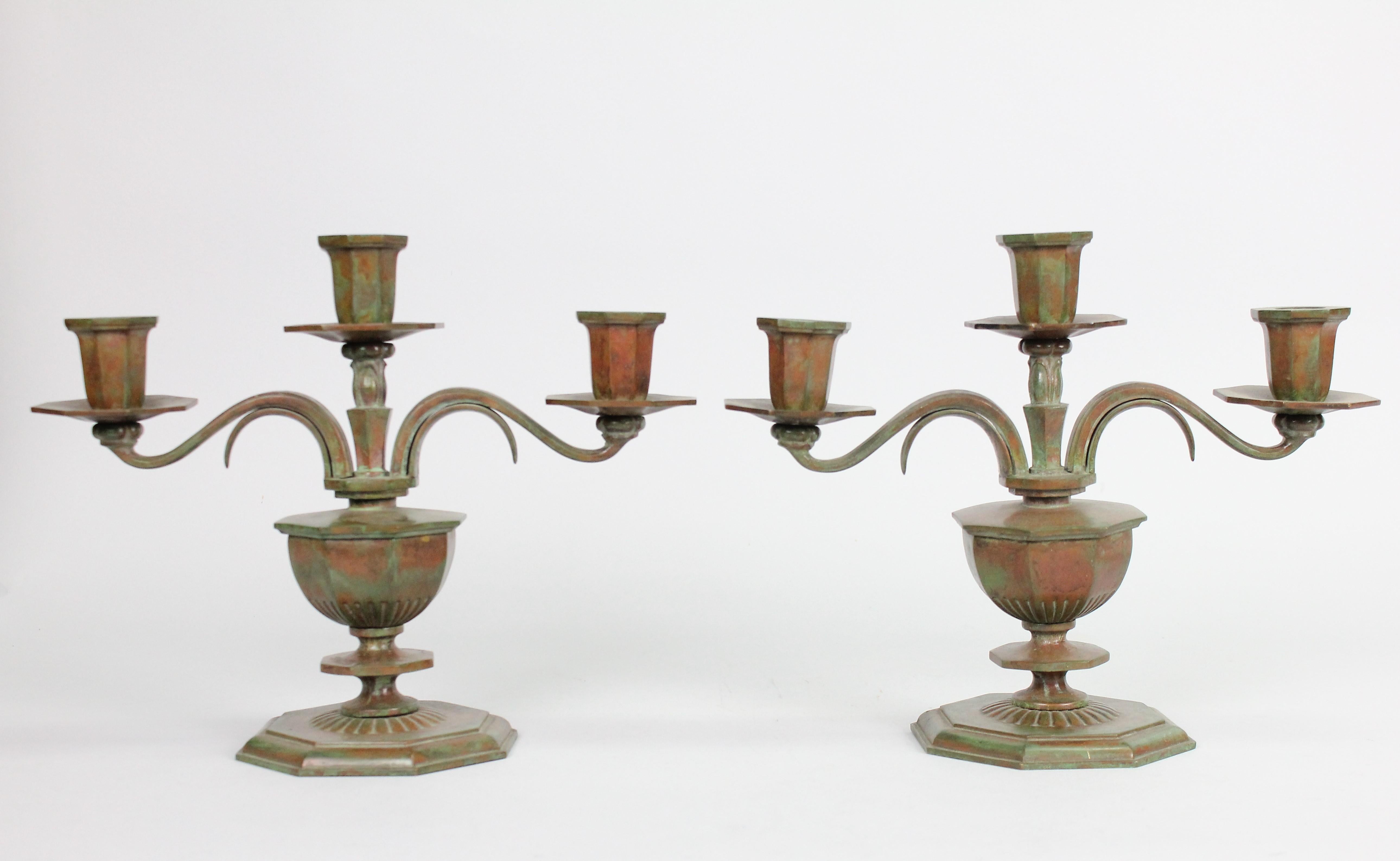 An unusual pair of patinated bronze candelabras by Sune Bäckström for Einar Bäckström Metallvarufabrik, Malmö Sweden, 1930s.

A heavy pair of bronze candelabras lovely patinated in green and brown colors.
Very nice condition. Signed and numbered