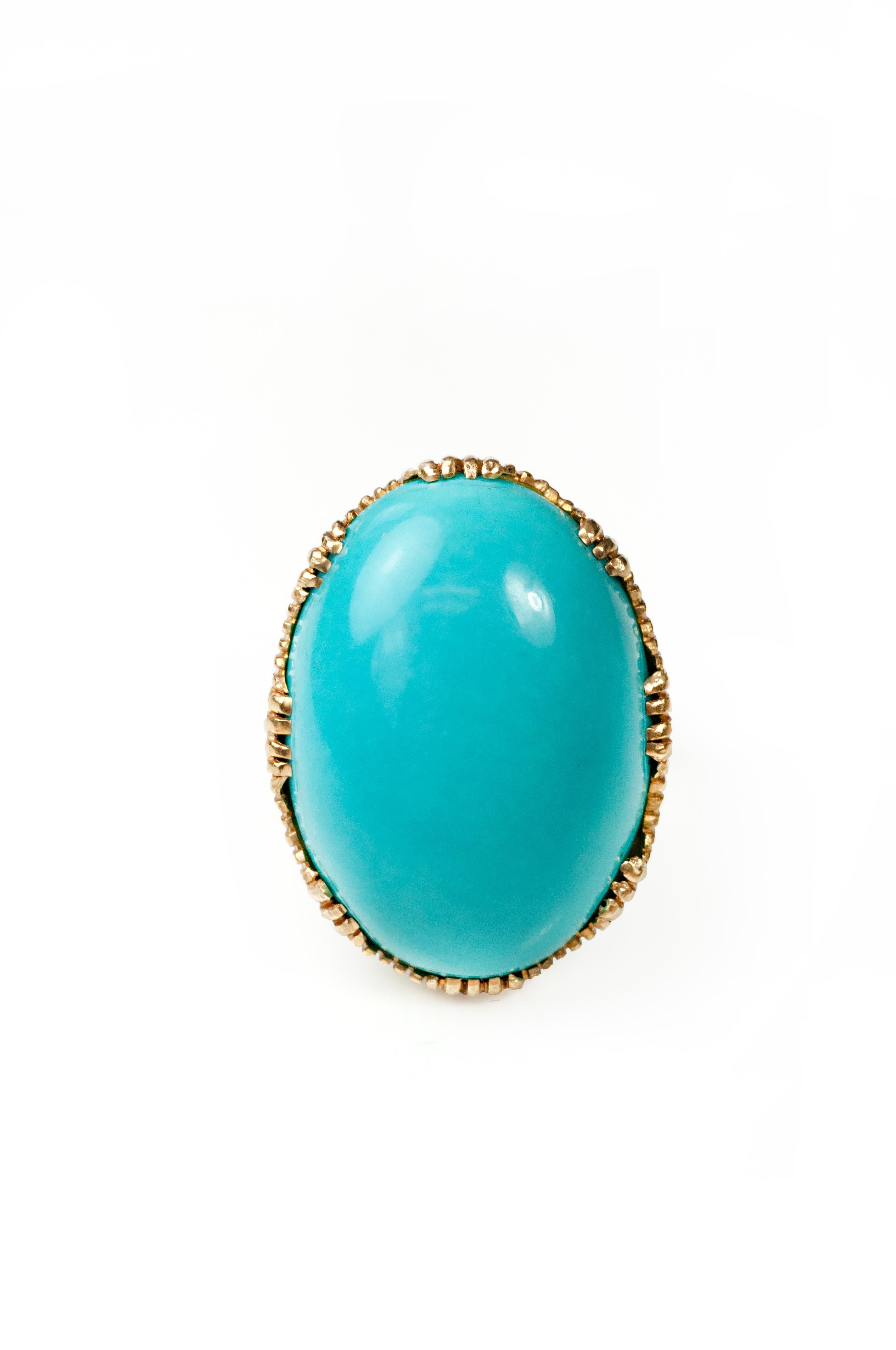 Sleeping beauty turquoise cabochon 23.00cts with 18K gold basket and 10K gold shank. Size 6.75.  

Sleeping Beauty turquoise is noted for its solid, light blue color with no matrix. It is a favorite of Zuni Pueblo lapidaries and silversmiths for the