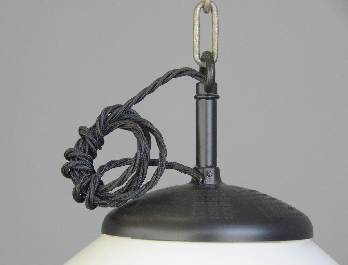 Sunflower Czech opaline pendant lights, circa 1940s.

- Price is per light
- Black bakelite tops
- Elegant shaped opaque glass with sunflower detail
- Comes with 100cm of black twist cable and ceiling rose
- Takes E27 fitting bulbs
- Czech,