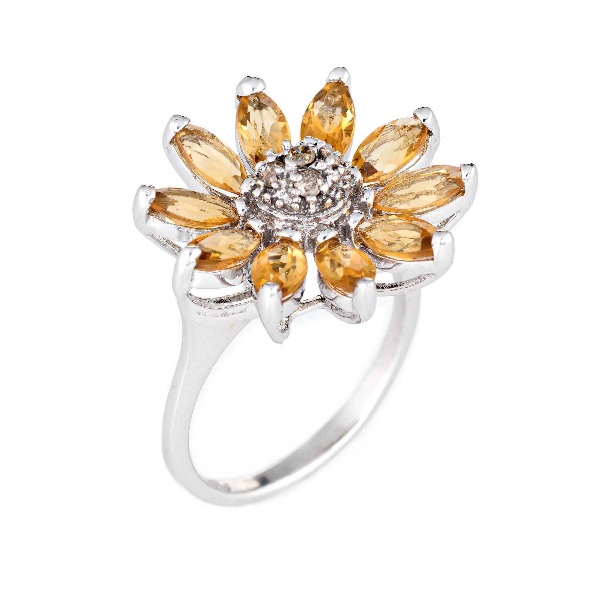Stylish estate sunflower ring crafted in 14 karat white gold. 

10 marquise cut citrines are estimated at 0.15 carats each (1.50 carats total estimated weight), accented with an estimated 0.05 carats of diamonds (estimated at L-M color and SI2-I1