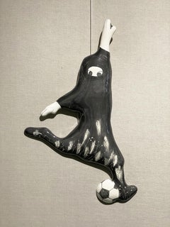 My ball, wall sculpture, two girls playing football by Korean artist Sungrea Kim