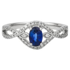 Zaffiro blu Sunita Nahata 0.70ct. Anello in 18KWG con diamante.
