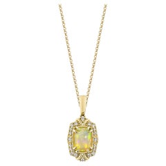 Opale etiope Sunita Nahata 0.80ct. Ciondolo in 14KYG con diamante.