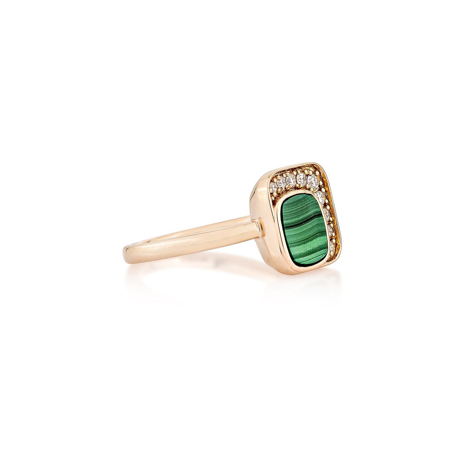 This Malachite Ring is a stunning piece featuring a cushion-shaped, brilliant green malachite gemstone framed by a halo of glittering diamonds. The diamonds add a radiant shine and enhance the natural beauty of the ring, creating a tasteful