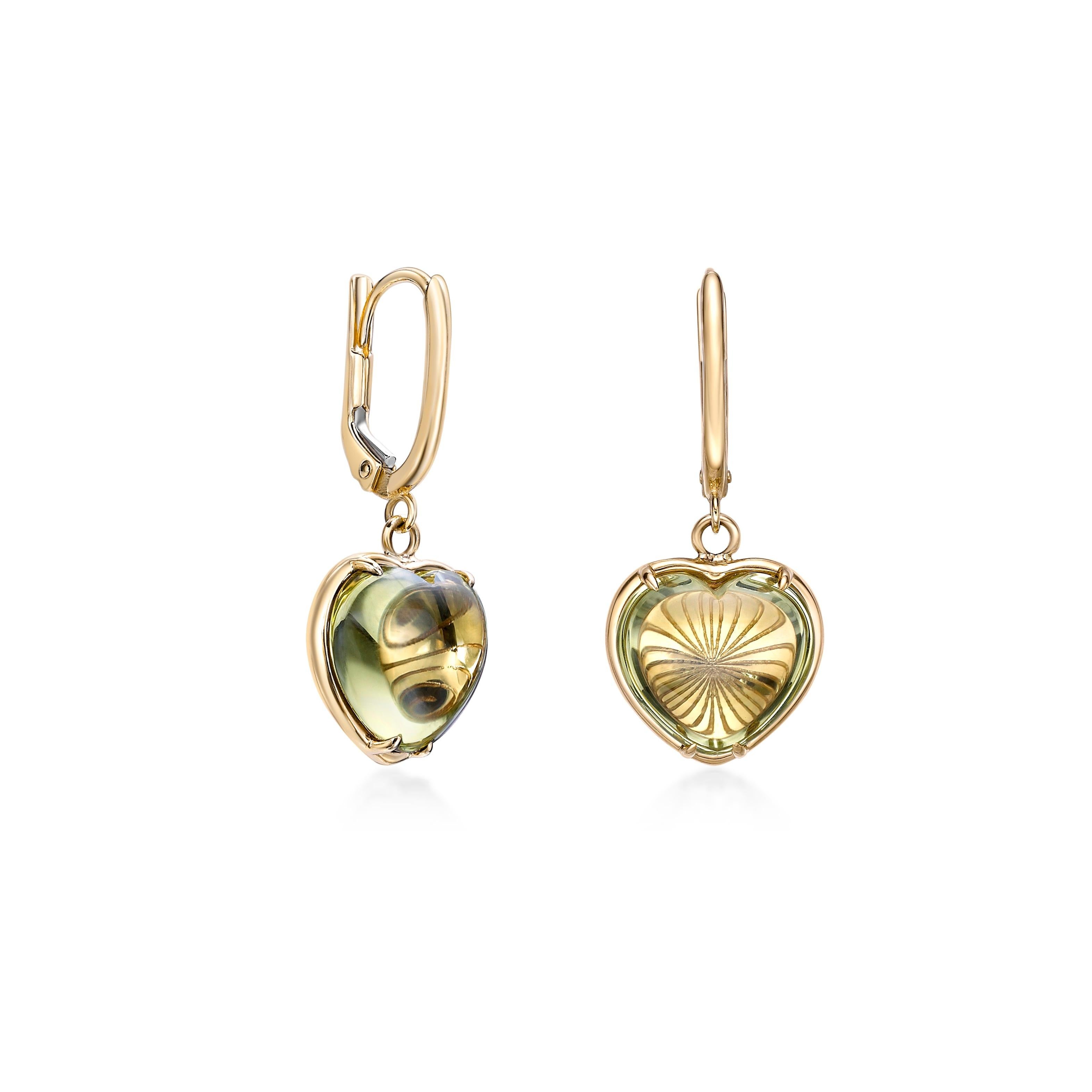 Elegant and romantic, these earrings feature heart-shaped lemon quartz cabochons, bezel-set in warm 18K yellow gold. The rich, earthy tones of the quartz beautifully contrast with the gold, creating a timeless and sophisticated design. Finished with