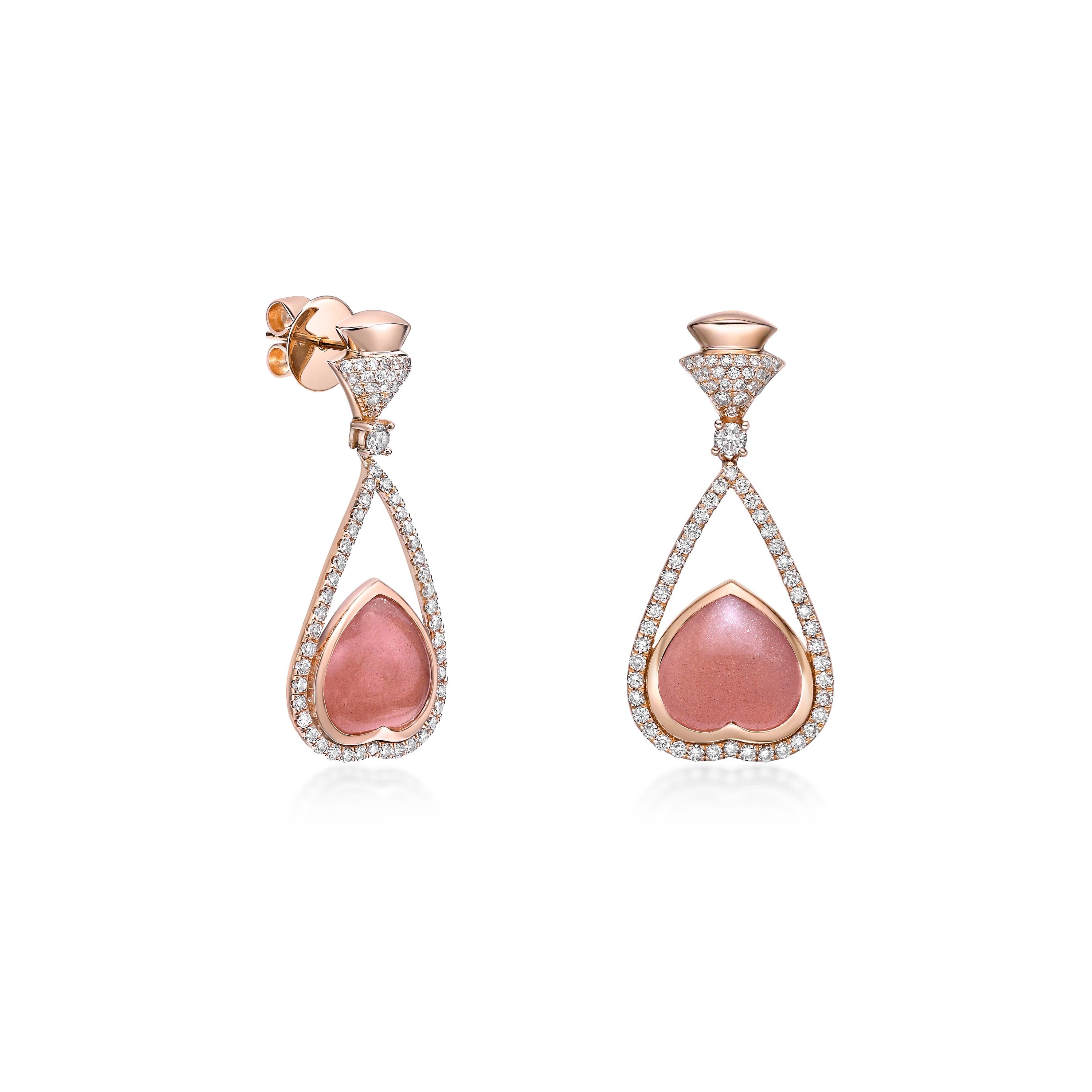Elegant drop earrings featuring heart-shaped cabochon orange moonstone, set in 18K Rose gold and framed by pave-set diamonds in a teardrop silhouette. A perfect blend of sophistication and sparkle.
  
Orange Moonstone Drop Earrings in 18Karat Rose