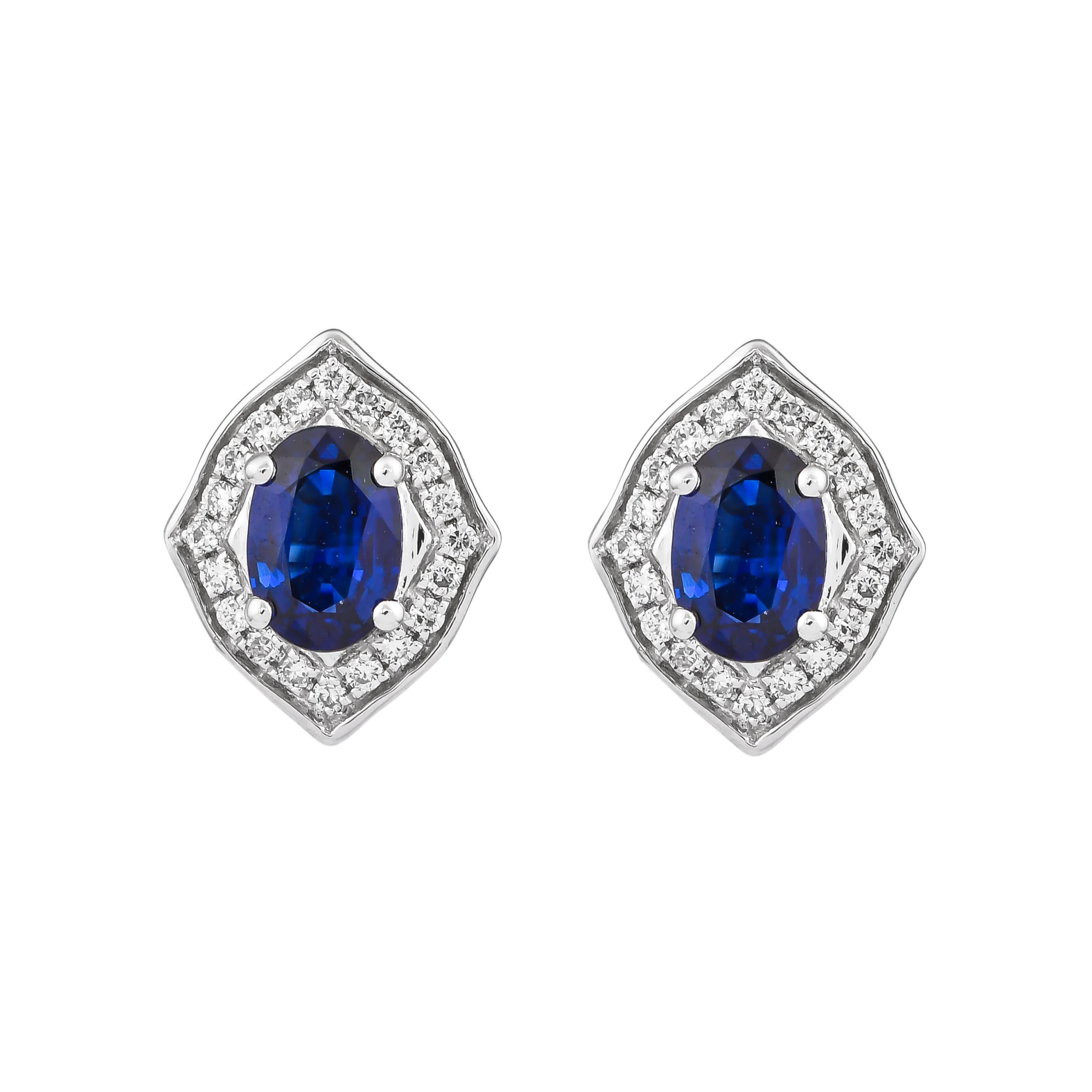 Elevate your jewelry collection with these exquisite blue sapphire earrings, expertly crafted in 18K white gold. Featuring brilliant blue sapphires that exude a deep, rich hue, each stone is beautifully complemented by sparkling diamonds that add a
