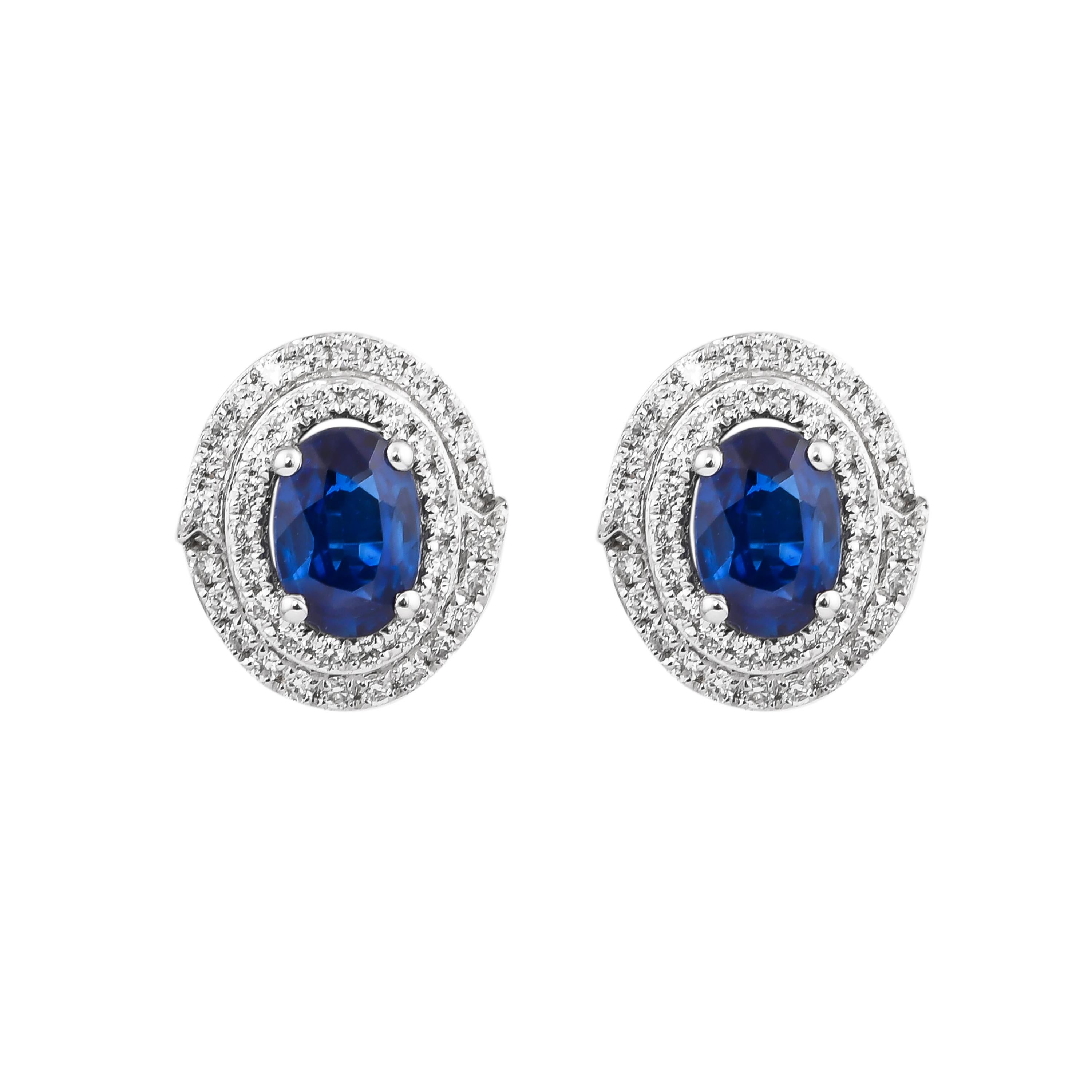 Elevate your jewelry collection with these exquisite blue sapphire earrings, expertly crafted in 18K white gold. Featuring brilliant blue sapphires that exude a deep, rich hue, each stone is beautifully complemented by sparkling diamonds that add a