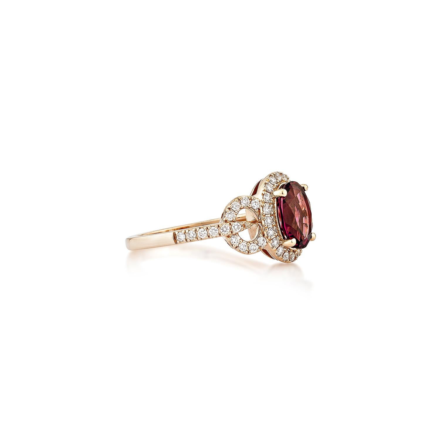 Sunita Nahata presents an elegant Rhodolite fancy ring in an oval shape, set with sparkling white diamonds. This exquisite piece exudes grace and elegance, making it perfect for both daily wear and special occasions. Crafted from 14-karat rose gold,