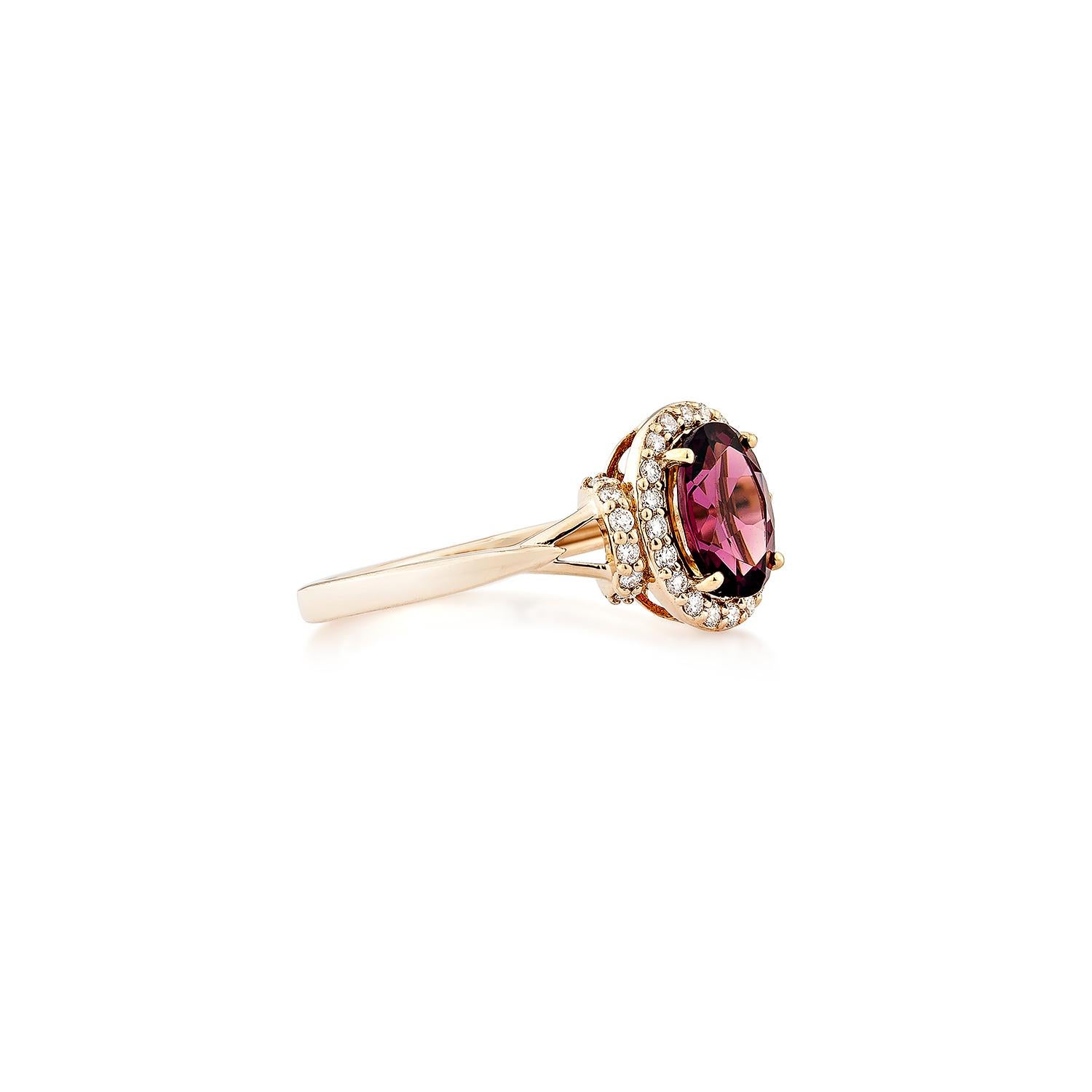 Sunita Nahata presents an elegant Rhodolite fancy ring in an oval shape, set with sparkling white diamonds. This exquisite piece exudes grace and elegance, making it perfect for both daily wear and special occasions. Crafted from 14-karat rose gold,