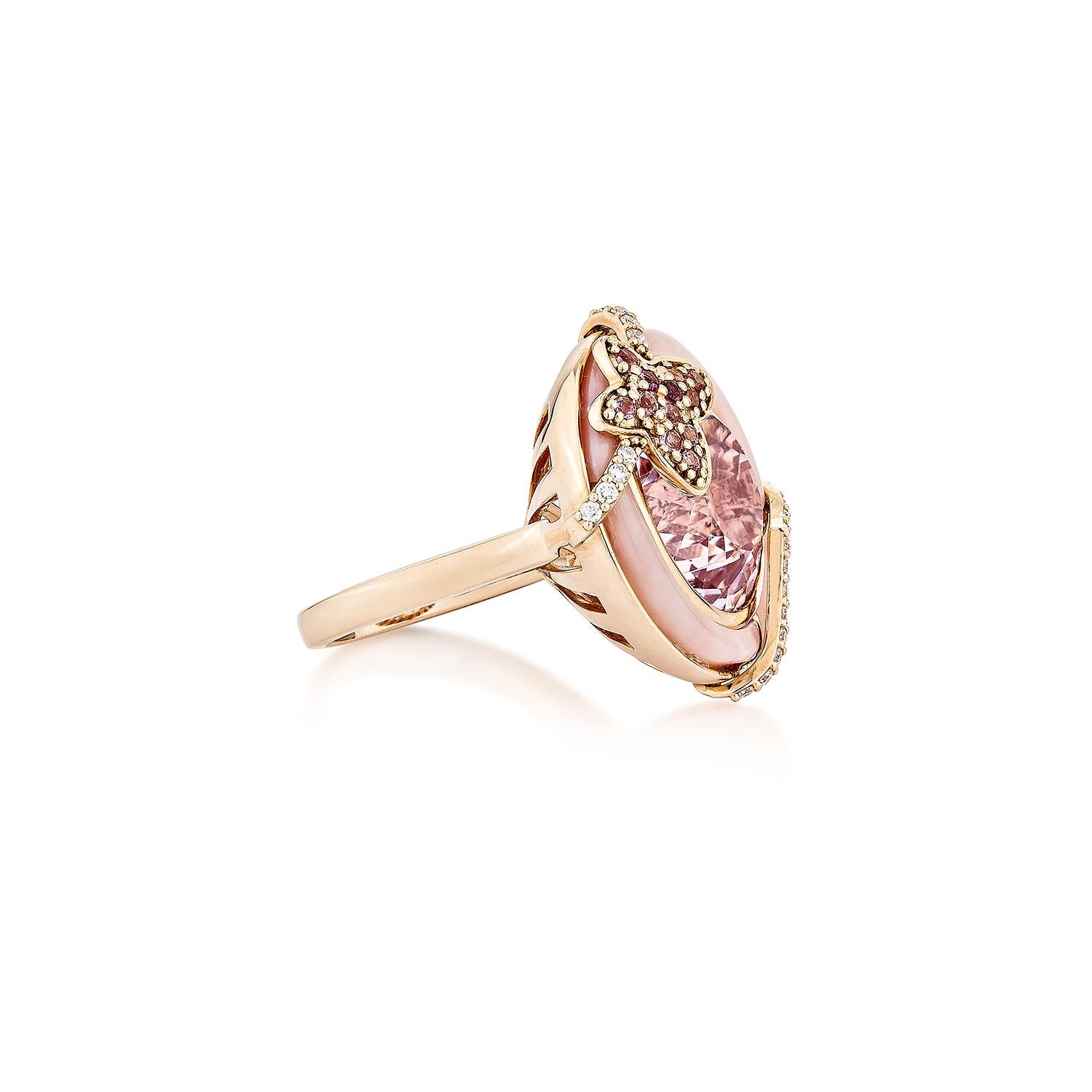 An ancient Kunzite ring with a butterfly studded with pink opal and pink tourmaline adds to the ring's beauty, and studded diamonds on both sides of the Kunzite that add to the ring's beauty are shown. This ring is composed of rose gold and is quite
