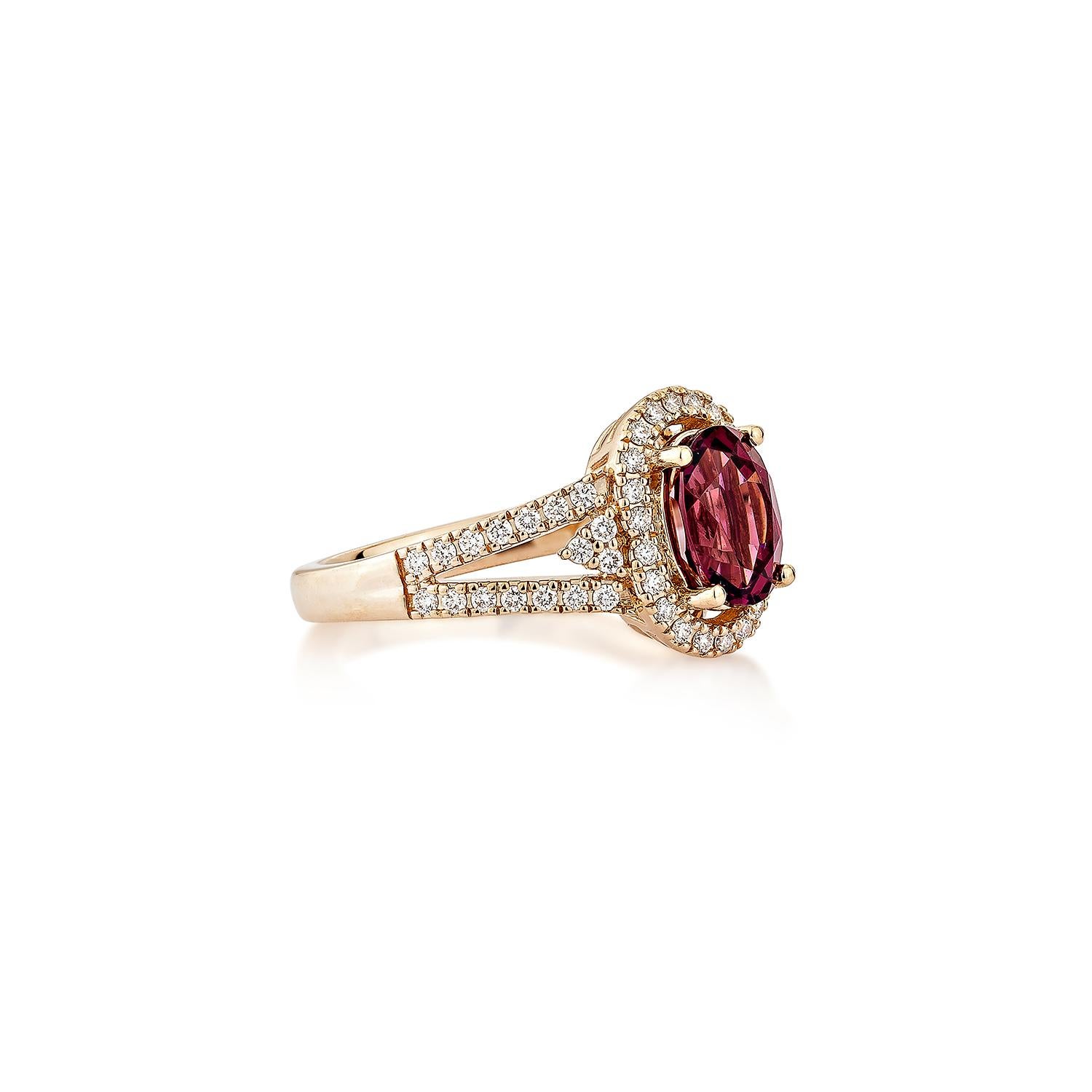 Sunita Nahata presents an elegant Rhodolite fancy ring in an oval shape, set with sparkling white diamonds. This exquisite piece exudes grace and elegance, making it perfect for both daily wear and special occasions. Crafted from 14-karat rose gold,