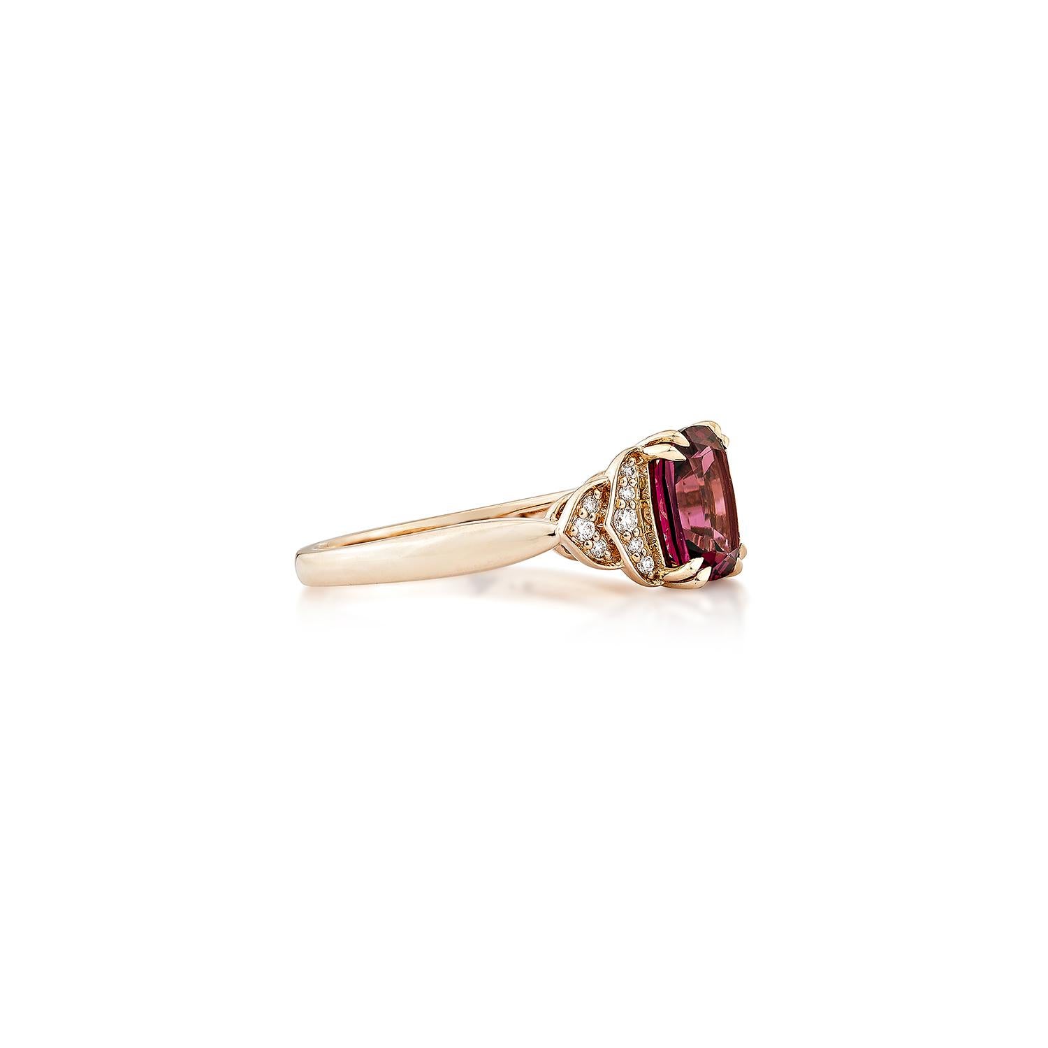 Sunita Nahata presents an elegant Rhodolite fancy ring in an cushion shape, set with sparkling white diamonds. This exquisite piece exudes grace and elegance, making it perfect for both daily wear and special occasions. Crafted from 14-karat rose