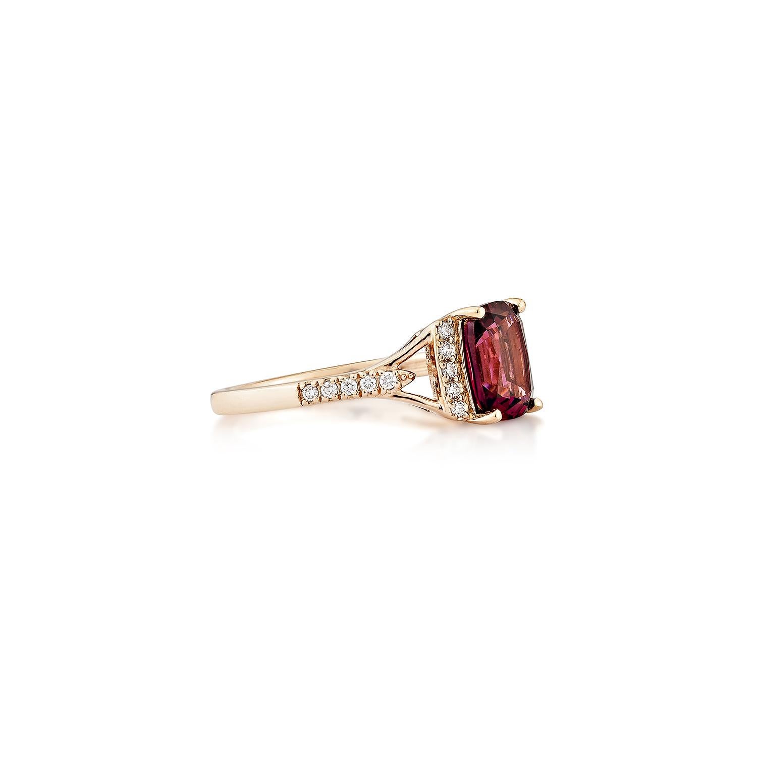 Sunita Nahata presents an elegant Rhodolite fancy ring in an cushion shape, set with sparkling white diamonds. This exquisite piece exudes grace and elegance, making it perfect for both daily wear and special occasions. Crafted from 14-karat rose