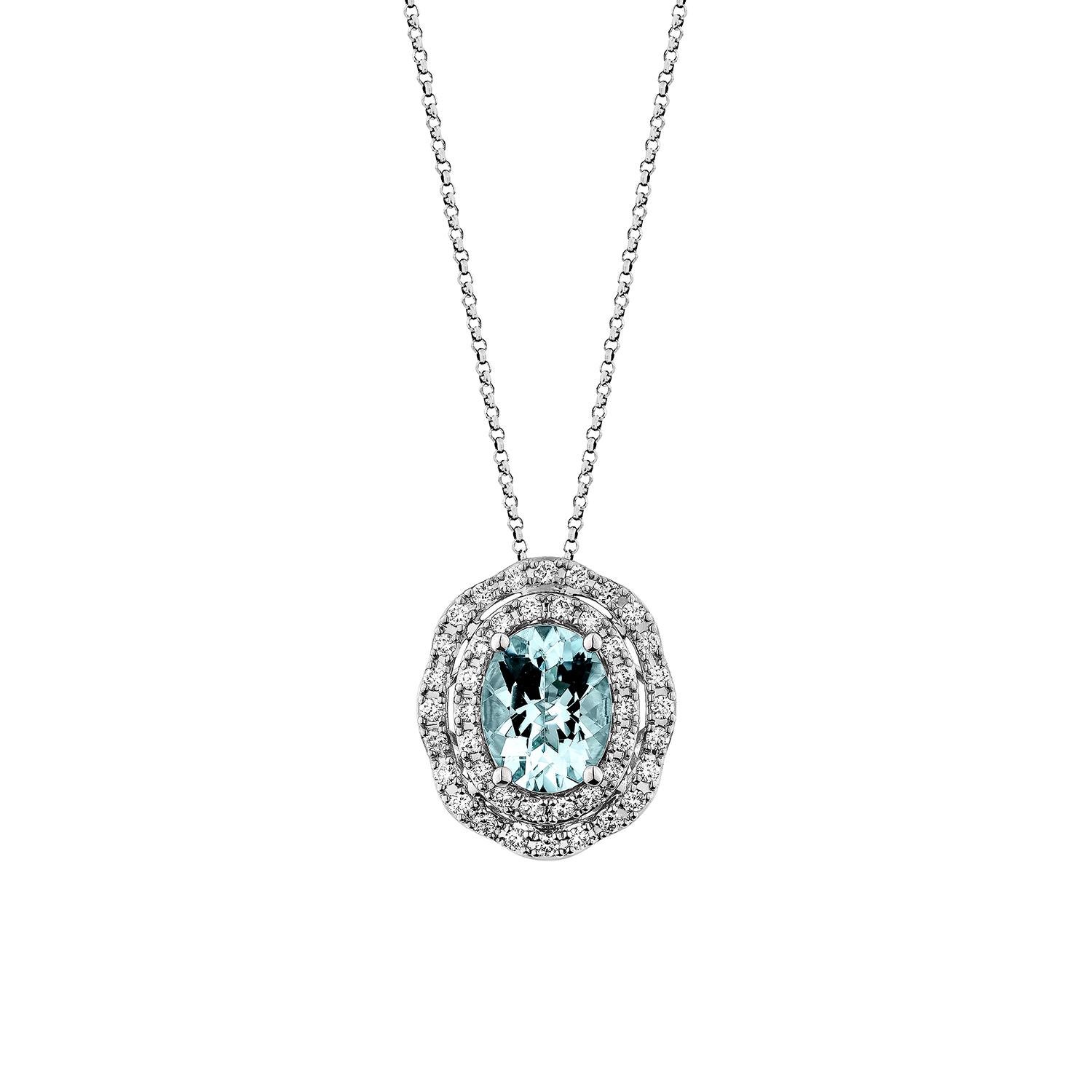 Elegante pendente a forma di acquamarina ovale in oro bianco 18 carati, impreziosito da diamanti brillanti, che emana una raffinatezza senza tempo e una bellezza serena.

Ciondolo con acquamarina in oro bianco 18 carati e diamante