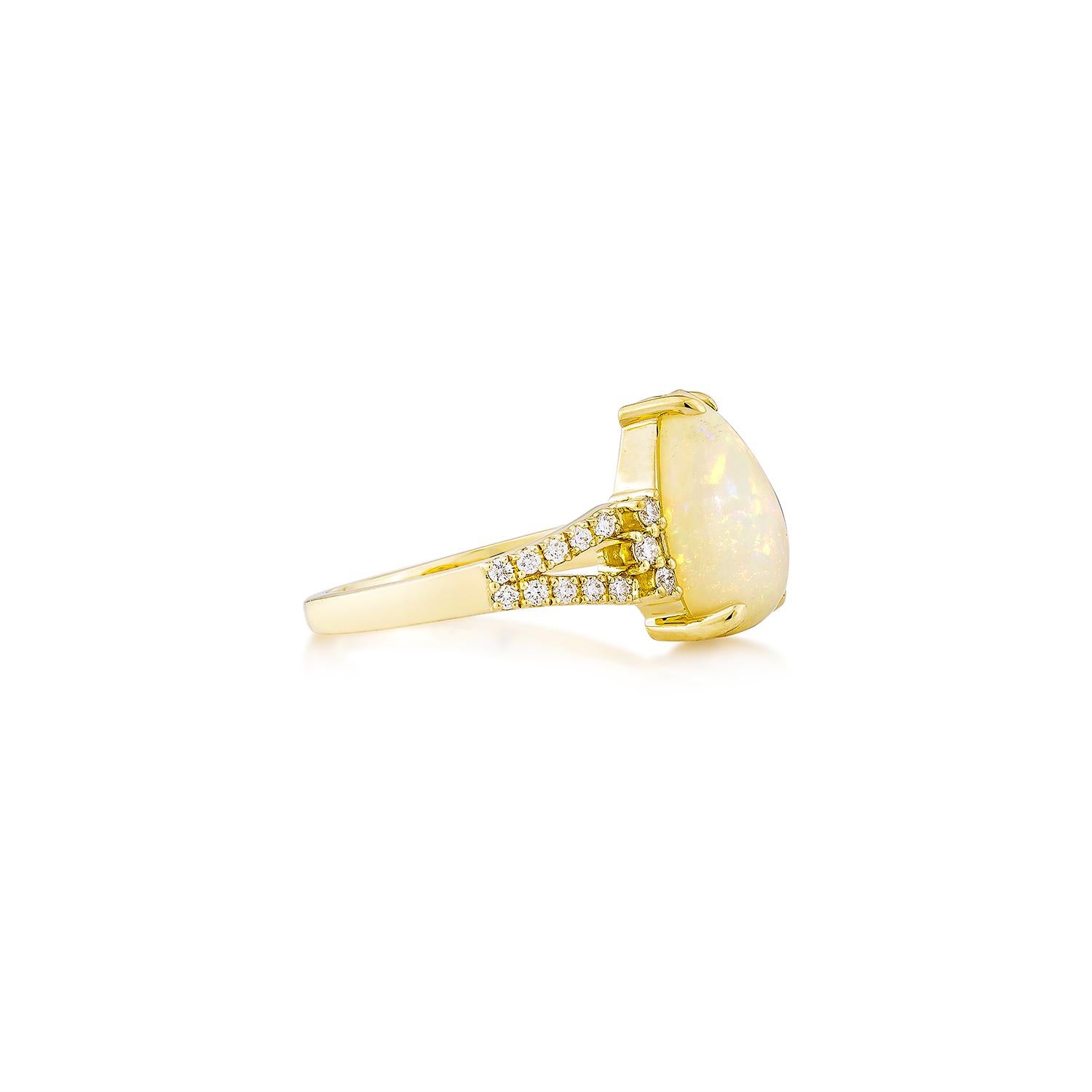Sunita Nahata presents a stunning Ethiopian opal cabochon ring, adorned with white diamonds. This gemstone, renowned for its historical significance, is believed to bring good luck, protection, and divine hope. Its metaphysical benefits include