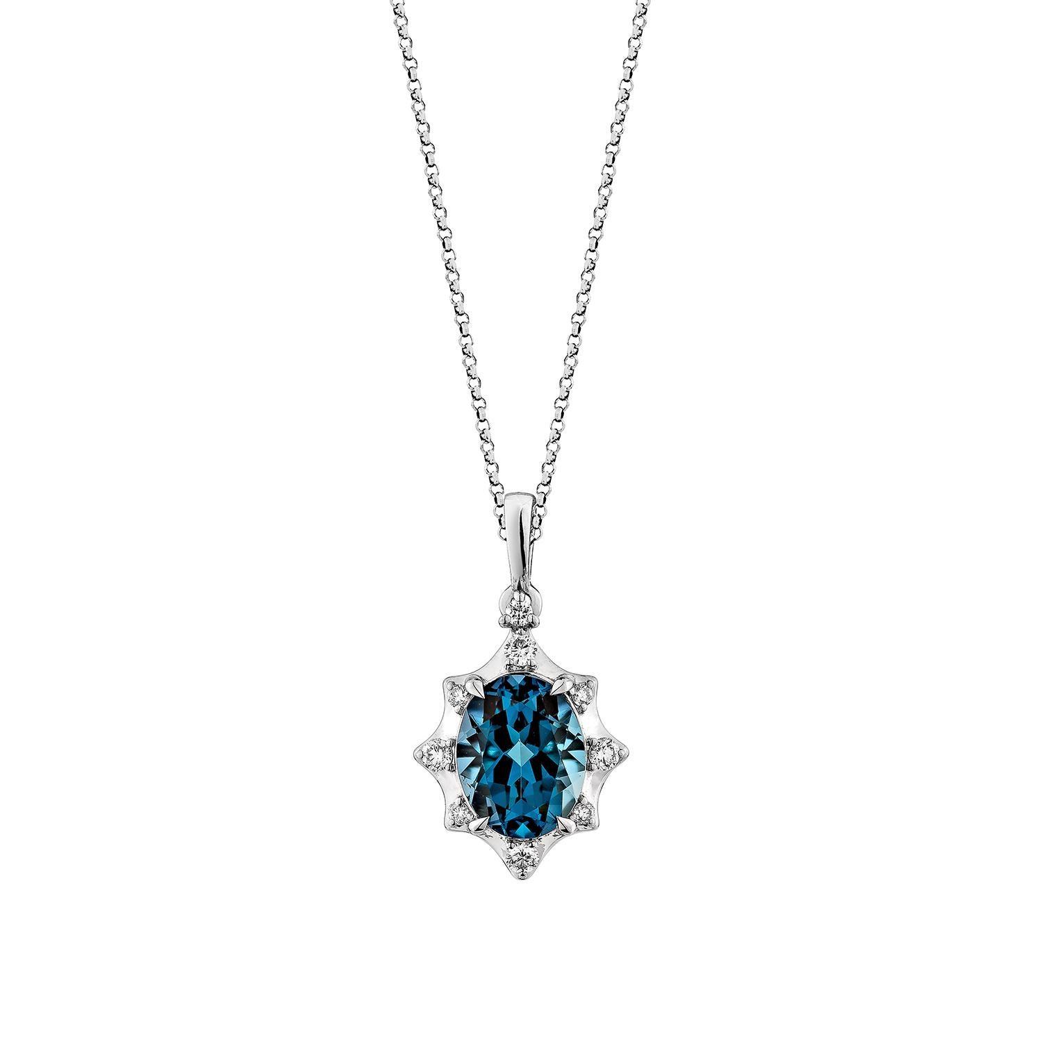 This stunning pendant features a mesmerizing oval-shaped London blue topaz, prized for its deep, captivating hue. The centerpiece is elegantly complemented by sparkling white diamonds, adding a touch of brilliance to the design. Set in lustrous