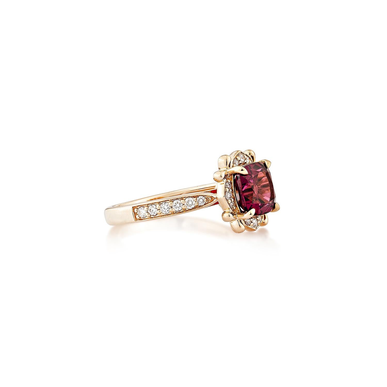 Sunita Nahata presents an elegant Rhodolite fancy ring in an cushion shape, set with sparkling white diamonds. This exquisite piece exudes grace and elegance, making it perfect for both daily wear and special occasions. Crafted from 14-karat rose