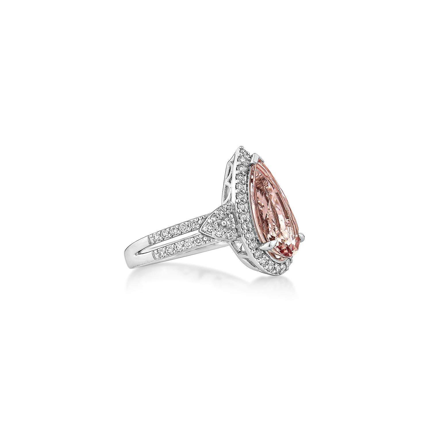 A graceful 18K white gold ring featuring a pear-shaped pink morganite, accented with sparkling diamonds for a touch of timeless elegance.

Pink Morganite Fancy Ring in 18KWG with Diamond.

Pink Morganite: 2.41 carat, 14X7mm size, Pear shape. 
White
