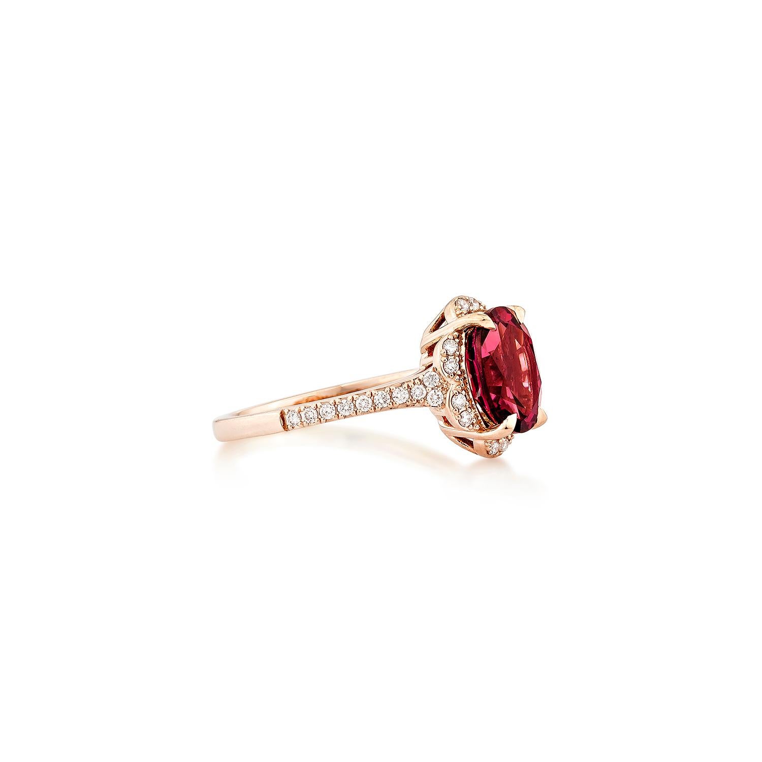 Sunita Nahata presents an elegant Rhodolite fancy ring in an oval shape, set with sparkling white diamonds. This exquisite piece exudes grace and elegance, making it perfect for both daily wear and special occasions. Crafted from 14-karat rose gold,