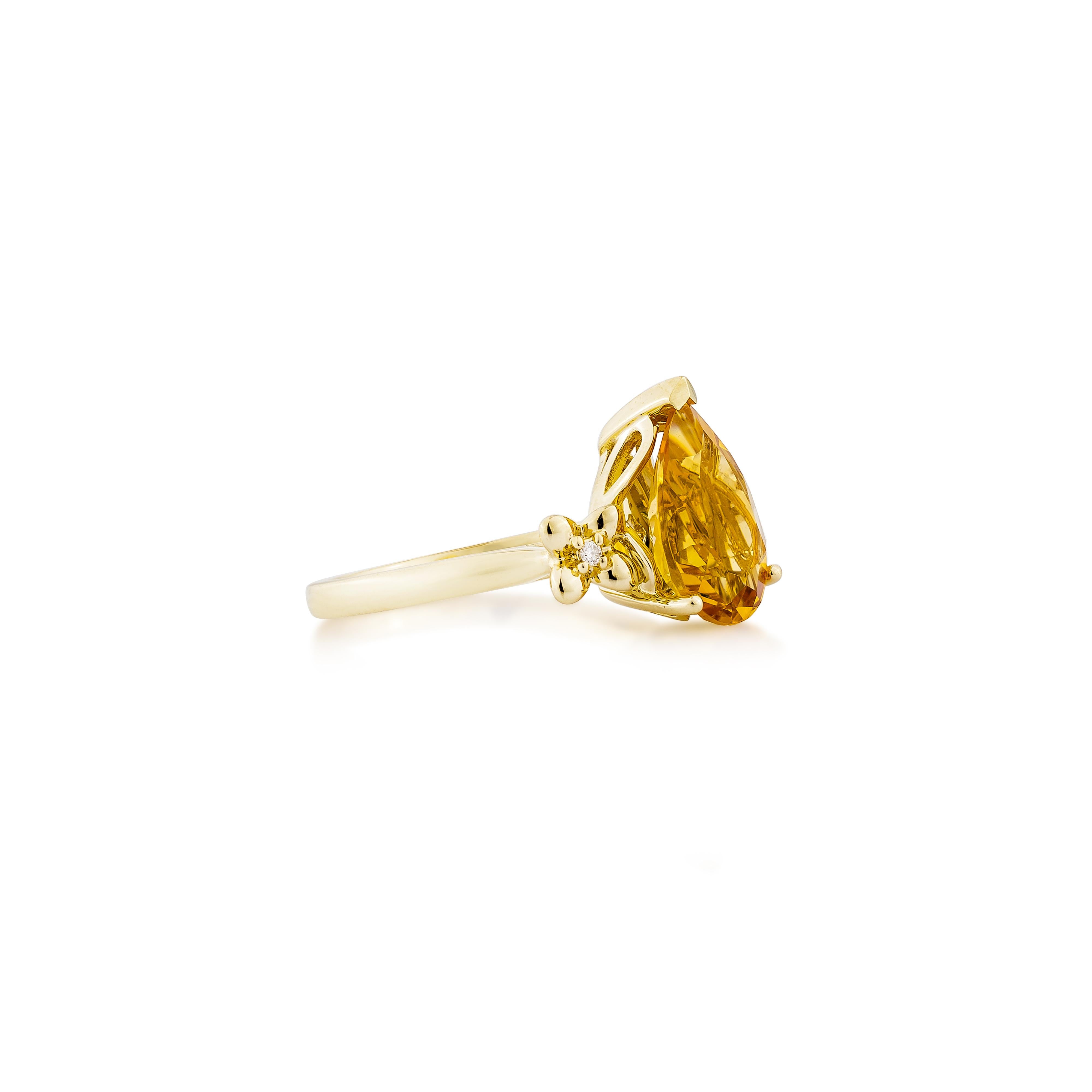 Radiating warmth and elegance, this fancy ring features a vibrant pear-shaped citrine set in 14K yellow gold. Accented with shimmering diamonds, it exudes a timeless charm, perfect for any occasion.
  
Citrine Fancy Ring in 14Karat Yellow Gold with