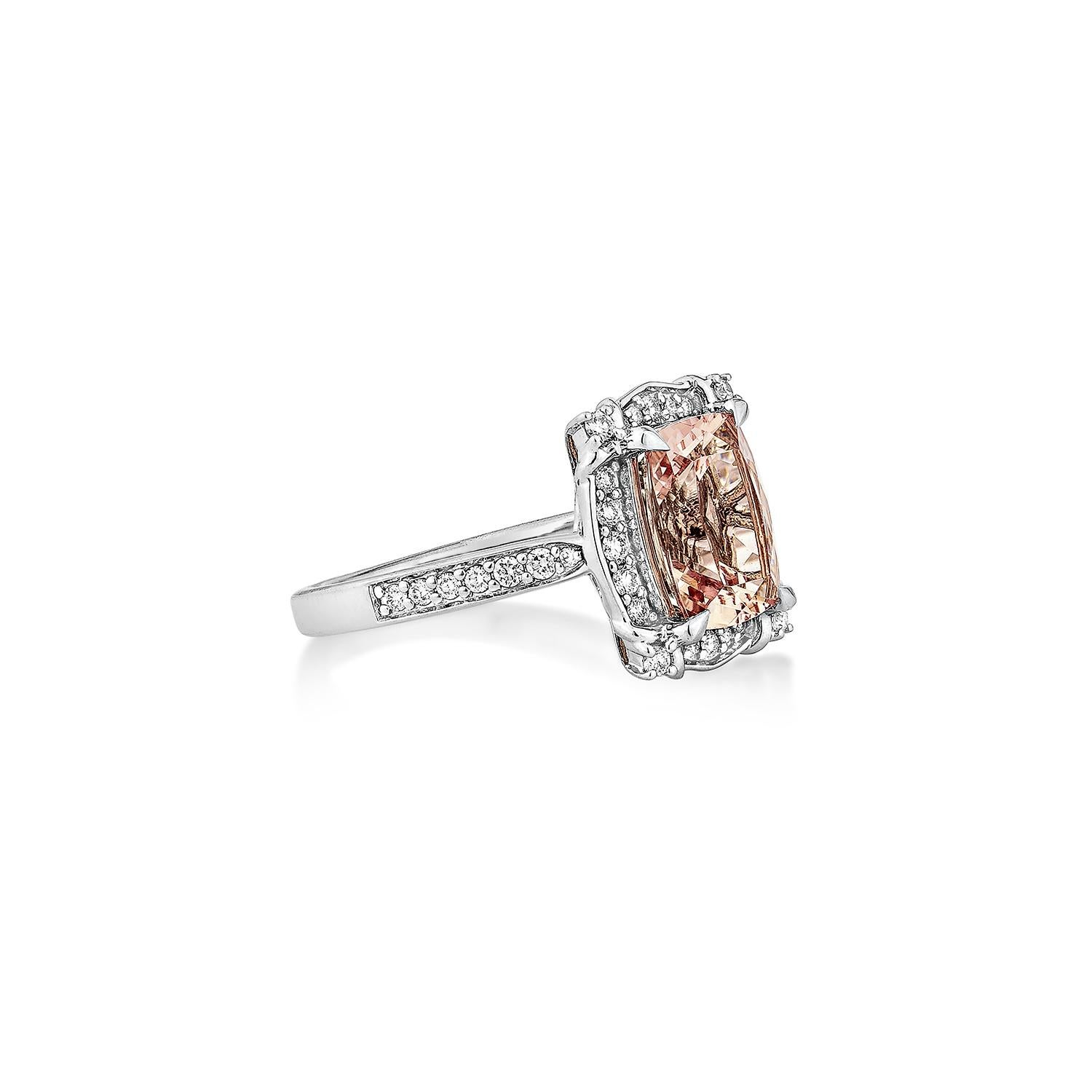 This collection includes a range of Pink Morganite, which is a symbol of love and relationships, making it an excellent choice for a variety of applications. Accented with White Diamond this ring is made in White Gold and present a classic yet