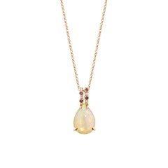 Sunita Nahata Opal and Pink Tourmaline 2.68ct. Pendant in 18KRG with Diamond.