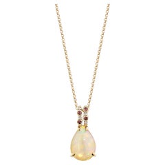 Opale e tormalina rosa Sunita Nahata 2,68ct. Ciondolo in 18KRG con diamante.