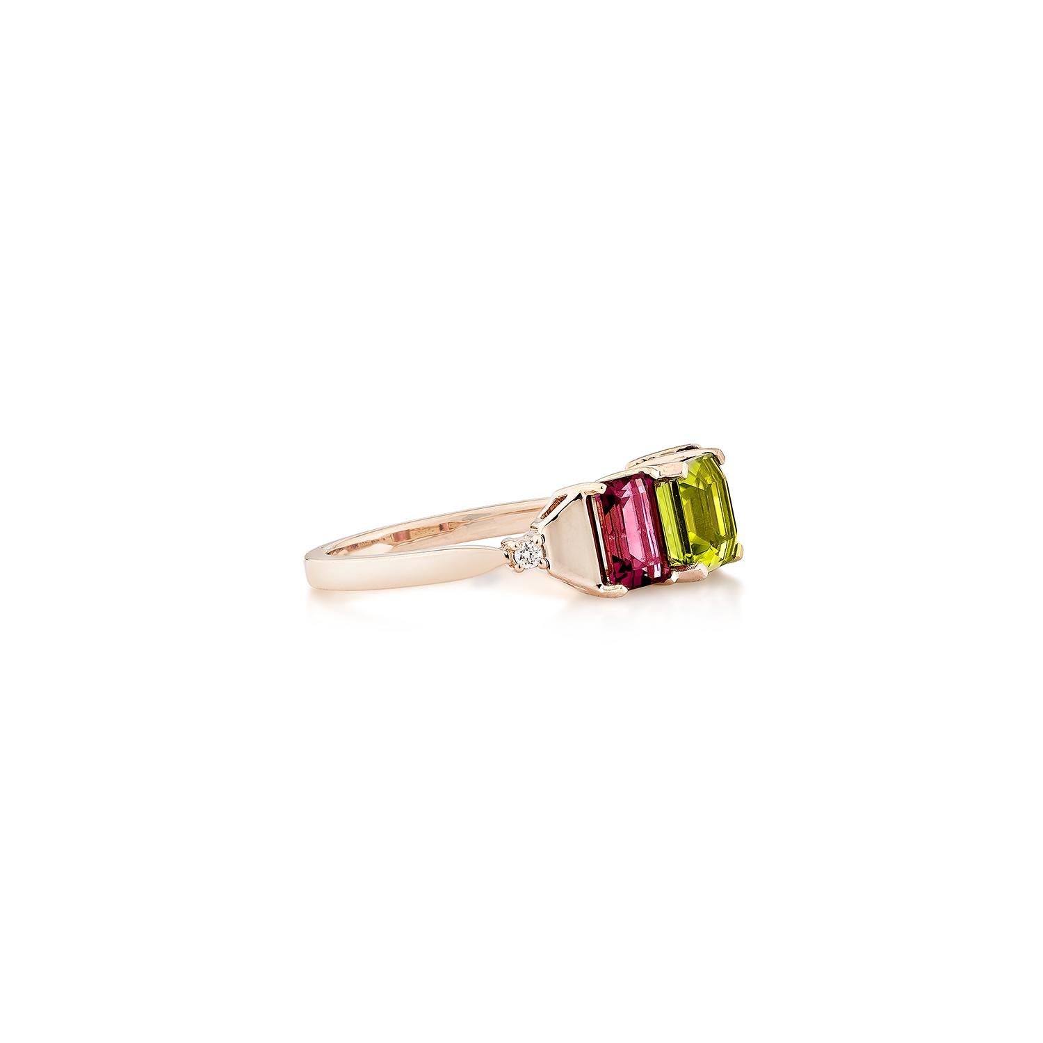 A bold and vibrant design featuring a radiant octagon-cut peridot at the center, flanked by two rich rhodolite. Set in warm 18K rose gold with delicate diamond accents, this elegant ring offers a striking contrast of colors and timeless