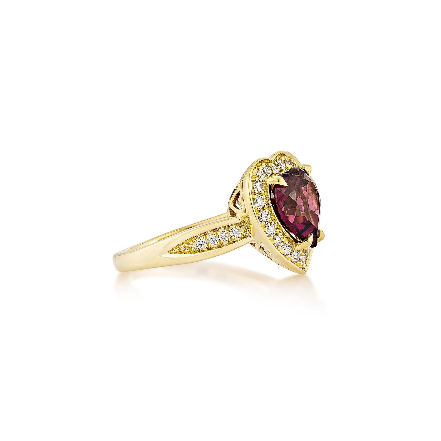 Sunita Nahata presents an elegant Rhodolite fancy ring in a heart shape, set with sparkling white diamonds. This exquisite piece exudes grace and elegance, making it perfect for both daily wear and special occasions. Crafted from 18-karat yellow