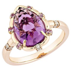 Sunita Nahata Amethyst 3.41ct. Ring in 18KRG with sapphire & White Diamond.