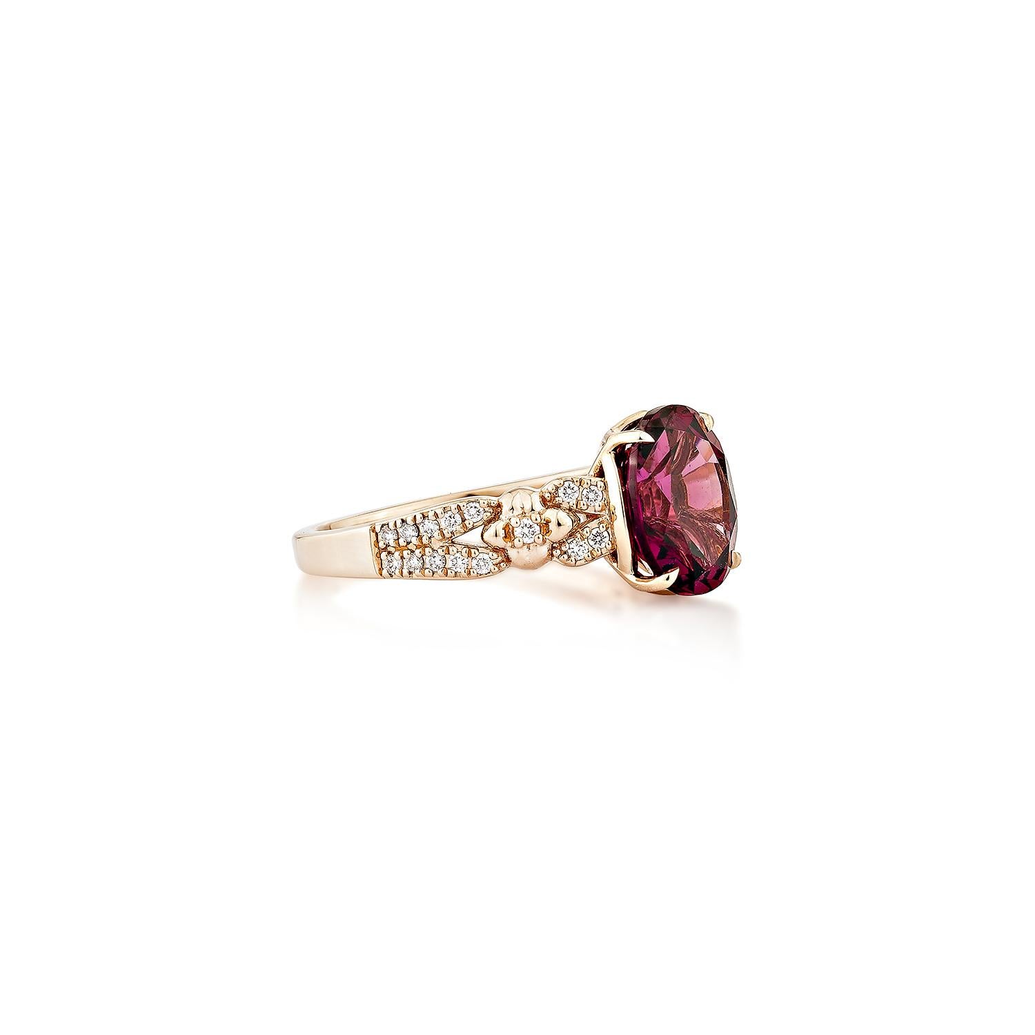 Sunita Nahata presents an elegant Rhodolite fancy ring in an oval shape, set with sparkling white diamonds. This exquisite piece exudes grace and elegance, making it perfect for both daily wear and special occasions. Crafted from 14-karat rose gold,