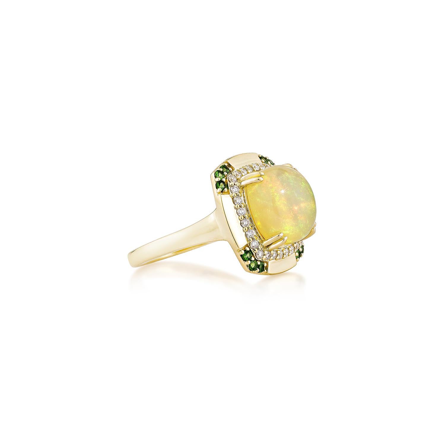 This exquisite ring showcases a luminous cushion-cut opal at its center, radiating iridescent hues that catch the light beautifully. Accentuating the opal's brilliance is a vivid round-shaped tsavorite, adding a pop of vibrant green to the design.