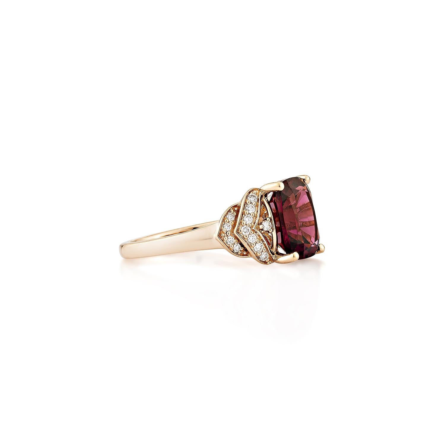 Sunita Nahata presents an elegant Rhodolite fancy ring in an cushion shape, set with sparkling white diamonds. This exquisite piece exudes grace and elegance, making it perfect for both daily wear and special occasions. Crafted from 14-karat rose