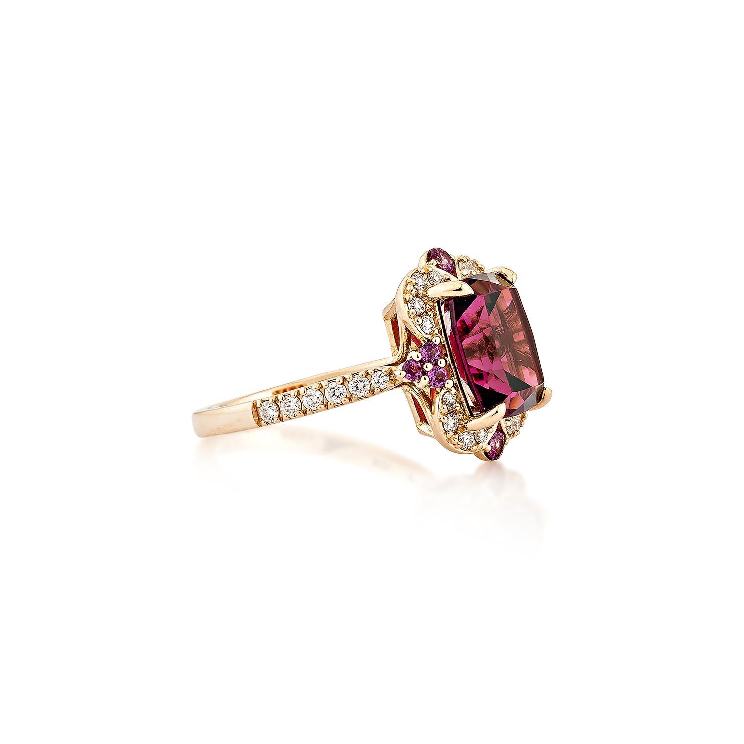 Sunita Nahata presents an elegant Rhodolite fancy ring in a cushion shape, set with sparkling white diamonds. This exquisite piece exudes grace and elegance, making it perfect for both daily wear and special occasions. Crafted from 18-karat rose
