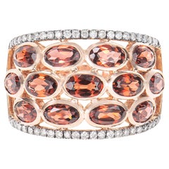 Sunita Nahata Roter Granat 4.16ct. Ring aus 14KRG mit braunem Diamant.