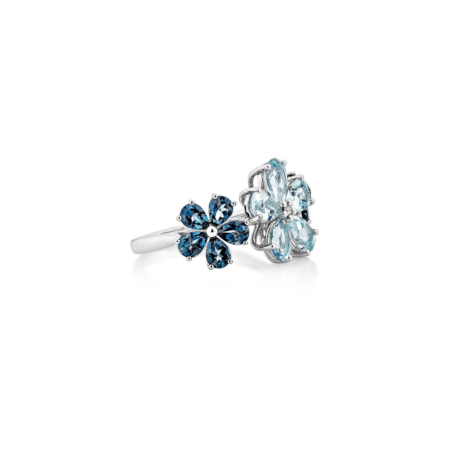 A nature-inspired statement piece, this Swiss & London Blue Topaz Ring blooms with brilliance in 14K white gold. The open-wrap design features a delicate flower and butterfly motif, adorned with pear-shaped blue topaz gemstones and sparkling diamond