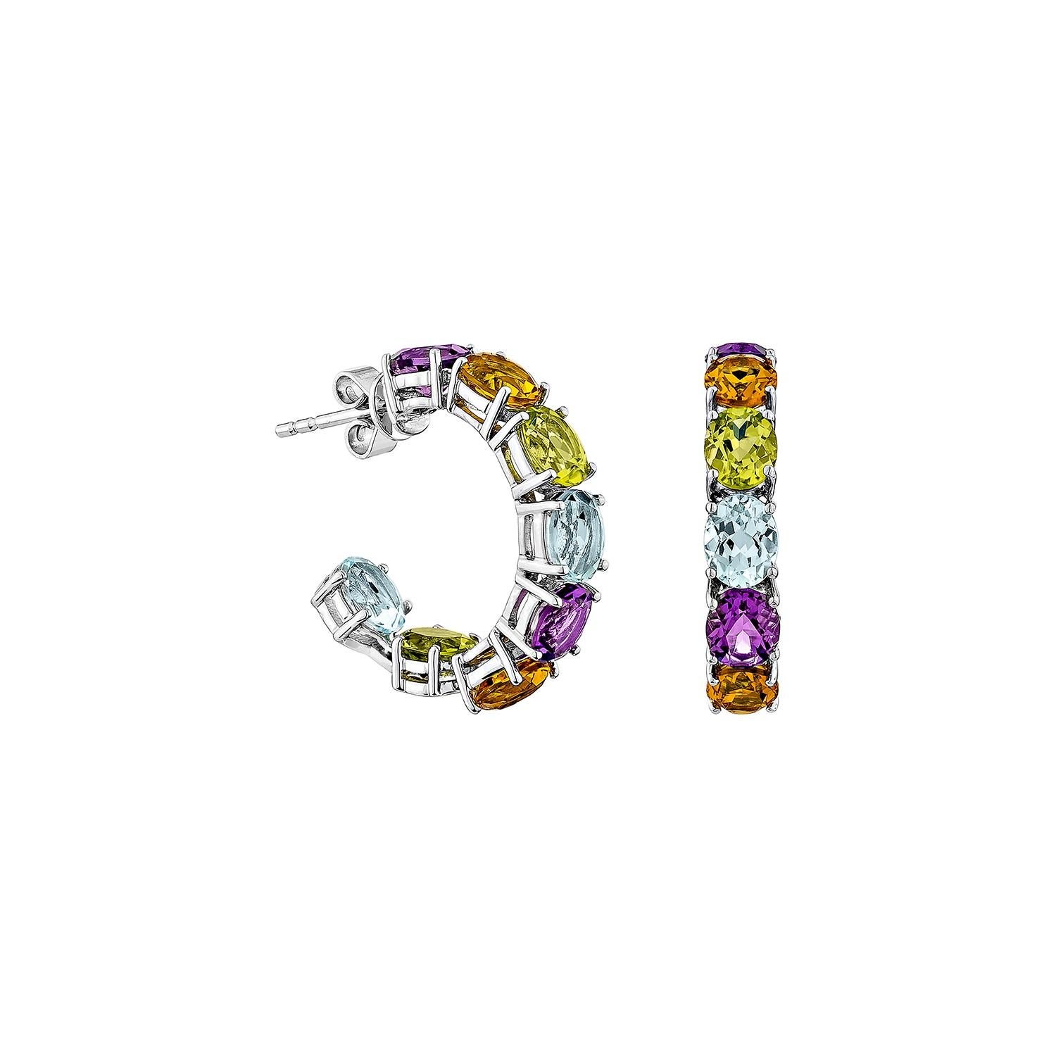Presenting the rainbow earrings from Sunita Nahata's Rainbow Collection. These gorgeous earrings are made up of vivid gemstones that reflect the rainbow's hues and symbolize hope, joy, and variety. These earrings offer elegance and luxury while