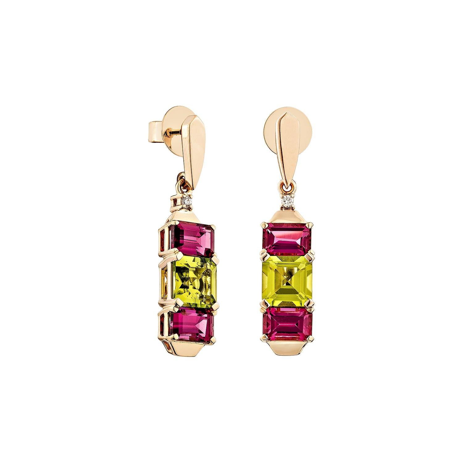 A bold and vibrant design featuring a radiant octagon-cut peridot at the center, flanked by two rich rhodolite. Set in warm 18K rose gold with delicate diamond accents, this elegant drop earrings offers a striking contrast of colors and timeless