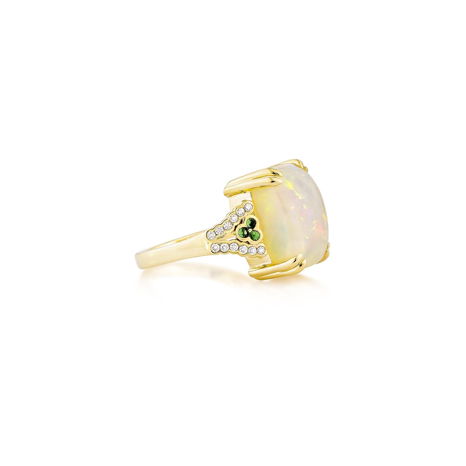Sunita Nahata presents a stunning Ethiopian opal cabochon ring, adorned with tsavorite and white diamonds. This gemstone, renowned for its historical significance, is believed to bring good luck, protection, and divine hope. Its metaphysical