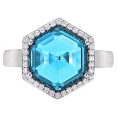 Sunita Nahata Swiss Blue Topaz 6.76ct. Fancy Ring in 18KWG with Diamond.