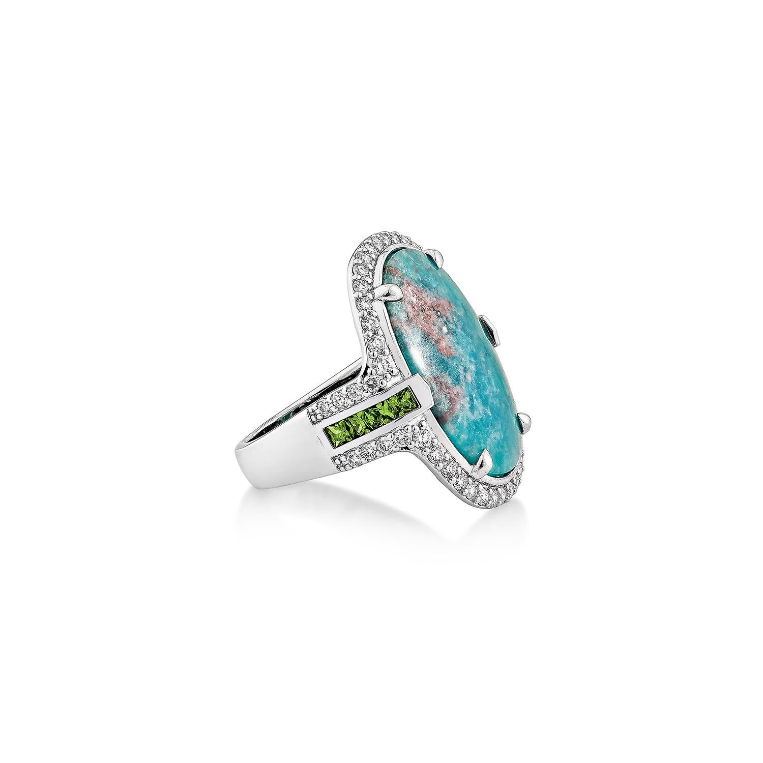 A captivating statement ring featuring an exquisite Paraiba tourmaline centerpiece, celebrated for its vivid oceanic hue and unique natural inclusions. Encased in a shimmering halo of brilliant-cut diamonds, this masterpiece is further accentuated