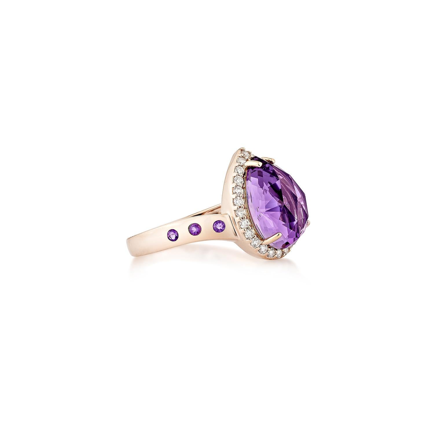 A captivating statement of elegance, this exquisite ring features a mesmerizing pear-shaped amethyst with a checkerboard cut, radiating brilliance from every angle. The vibrant purple gemstone is set in warm 14K rose gold, beautifully accentuated by