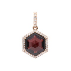 Sunita Nahata Garnet 6.77ct. Pendant in 18KRG with Diamond.